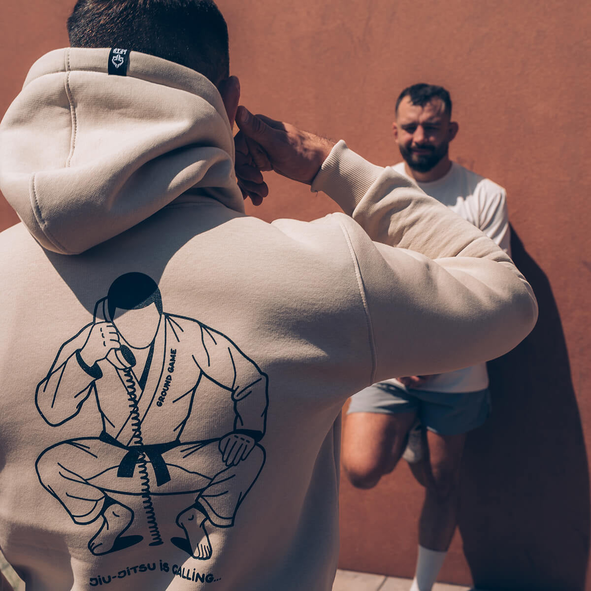 Jopa s kapuco Jiu-Jitsu is Calling x Noize (bež)